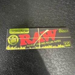 RAW Black Organic Hemp Papers pack, close-up on a dark surface