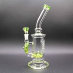 Joel Halen Illuminati Rig, clear glass dab rig with a yellow-green accent, side view