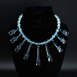 Lace Face Necklace, light blue glass beaded necklace on display stand, front view
