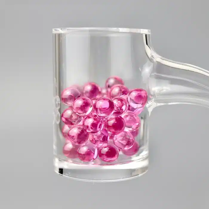 Ruby Pearl Co Pink Sapphire Pearl Set, glass mug filled with pink terp pearls