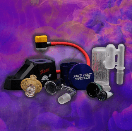 Santa Cruz Shredder grinder with glass adapters, a coil torch and other smoking accessories