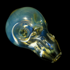 Solid Glassworks Skull Pipe in blue and gold fumed glass, angled view