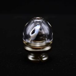 Sweers Mini Shark Pivot Top in Electrum with white shark figure, angled view