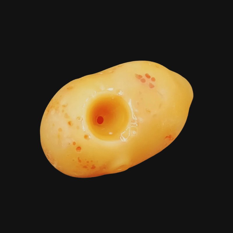 AlecBlowsGlass potato pipe in amber glass with a dimpled center and red speckles