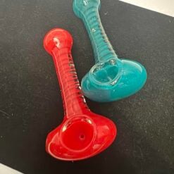 Puffr Spiral spoon pipes shown in red and teal glass
