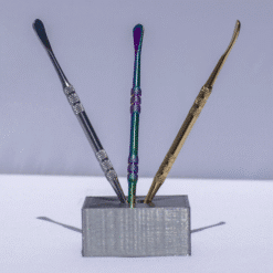 Stainless dab tools in rainbow, blue and gold finishes, shown in a stand