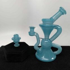 Blob Glass Really Teally recycler dab rig shown with its matching carb cap