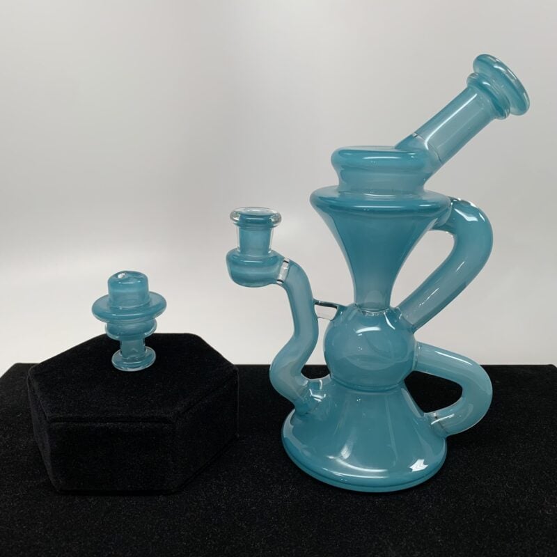 Blob Glass Really Teally recycler dab rig shown with its matching carb cap