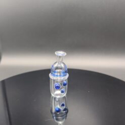 JD carb cap set in clear glass with blue dot accents