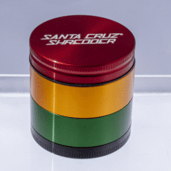 Santa Cruz Shredder 4-piece grinder in rasta red, gold and green