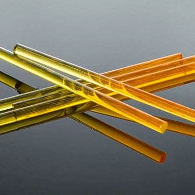 Borosilicate CFL glass showing two different hues under different light sources.
